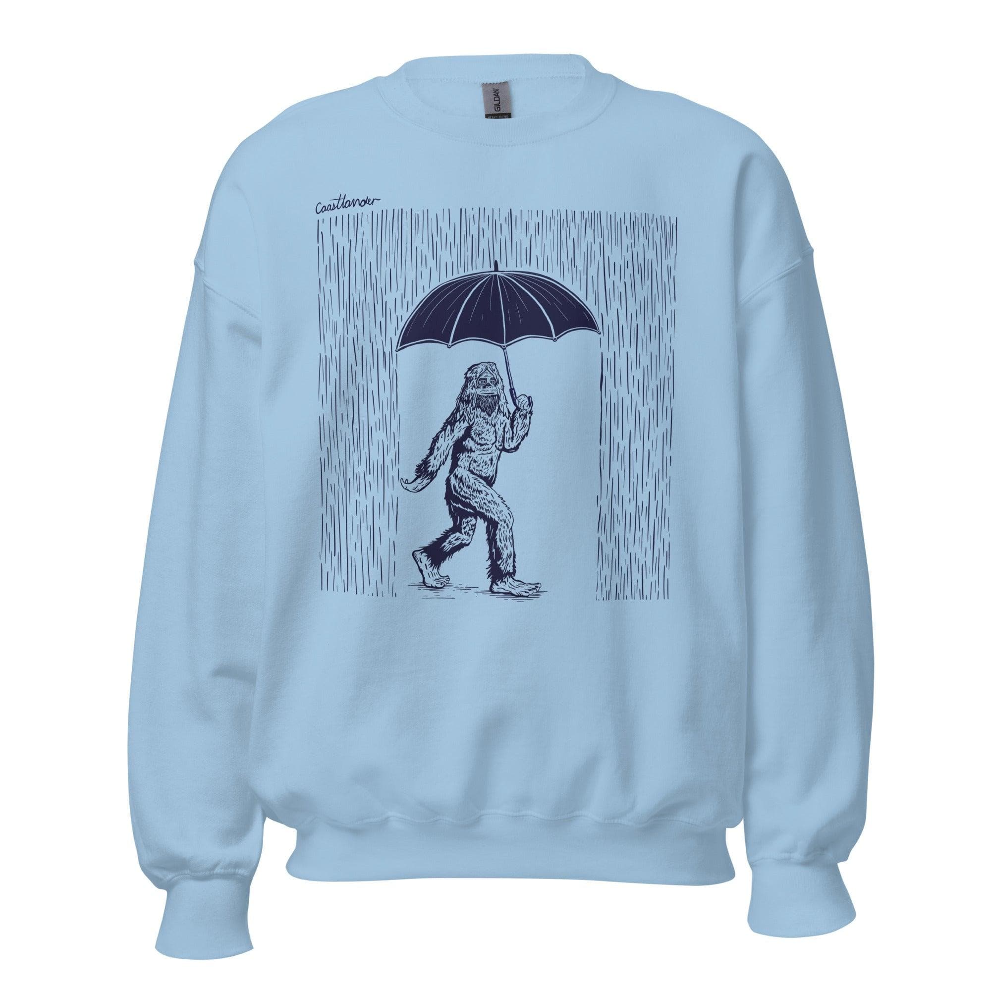 Design of Bigfoot with Umbrella in Rain - Unisex Sweatshirt , the colour is Light Blue